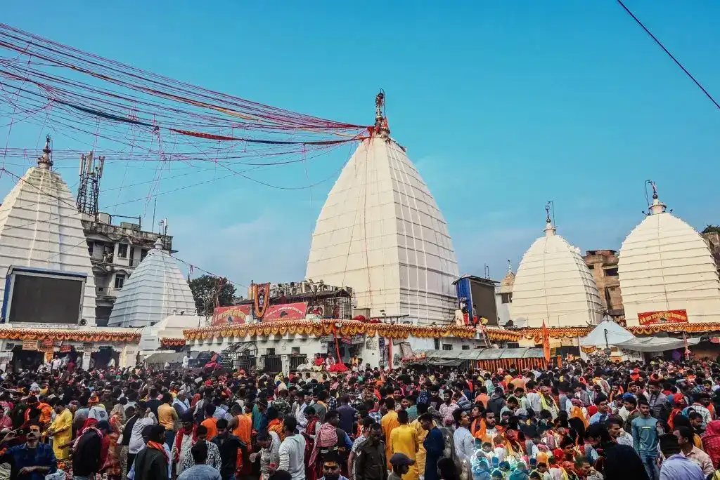 "Baba Baidyanath Temple spire with sacred red threads during Deoghar tour"