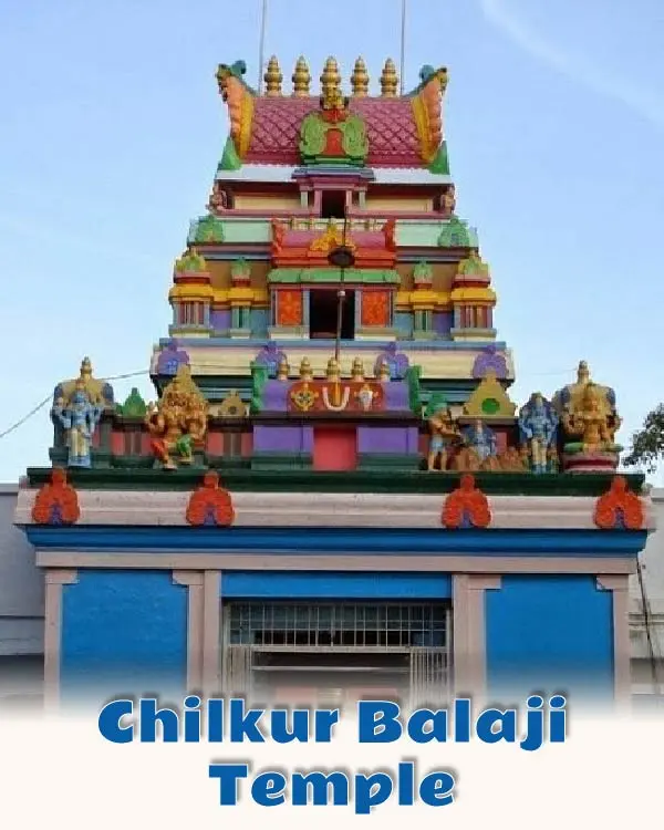 Chilkur Balaji Temple in Hyderabad—the colorful, multi-tiered Gopuram tower of the famous Visa Balaji temple decorated with traditional Hindu deity sculptures.