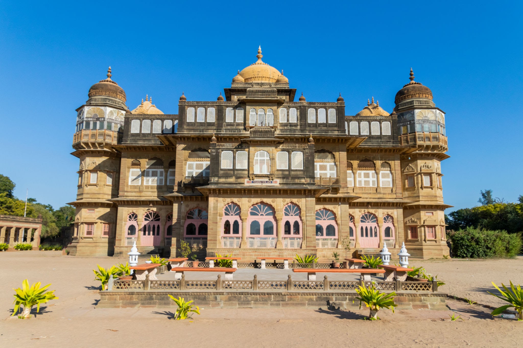 Vijay Vilas Palace Mandvi heritage red sandstone architecture with Rajput style domes and grand balconies in Kutch Gujarat